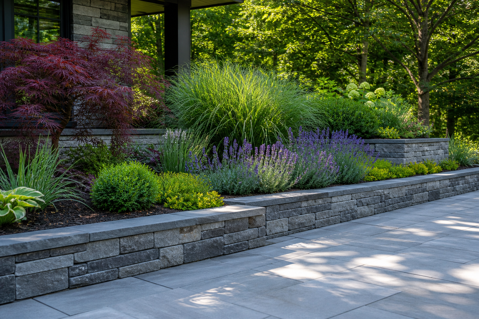 Raised planting beds beside a modern stone patio
