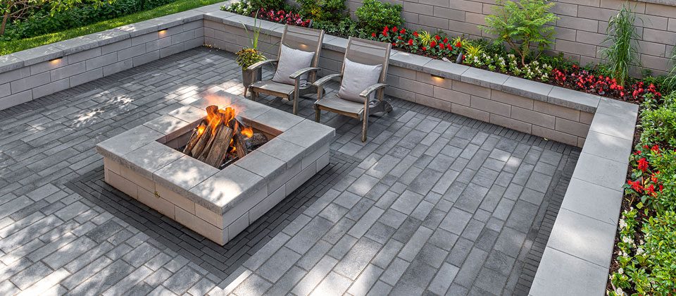 Landscape stone wall and paved outdoor area
